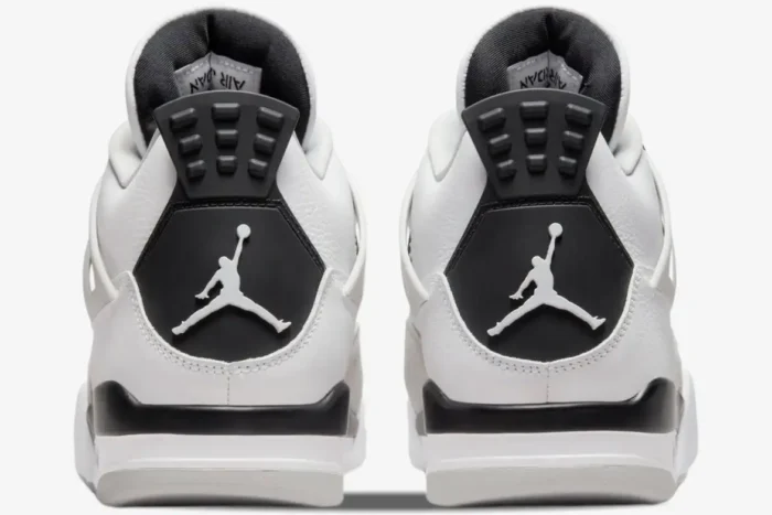 Rear view of the Air Jordan 4 Retro Military Black sneakers showing the black heel tabs and white Jumpman logos. - SKU DH6927-111