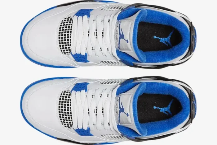 Top-down view of white and blue Air Jordan 4 Retro Motorsports sneakers with white laces. - SKU 308497-117