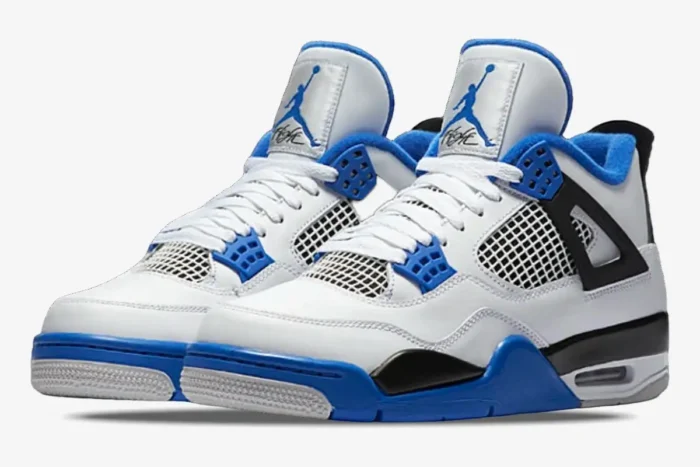 Air Jordan 4 Retro Motorsports sneakers in white, blue, and black, shown from a three-quarter front angle. - SKU 308497-117