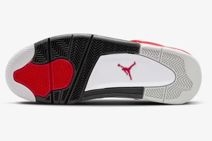 Bottom view of Air Jordan 4 Retro Red Cement outsole featuring white, black, and red herringbone traction patterns. - SKU DH6927-161