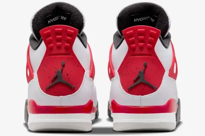 Rear view of Air Jordan 4 Retro Red Cement sneakers featuring red speckled heel tabs and black Jumpman logos. - SKU DH6927-161