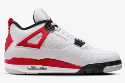 Side profile of Air Jordan 4 Retro Red Cement sneakers featuring white leather and red speckled accents. - SKU DH6927-161