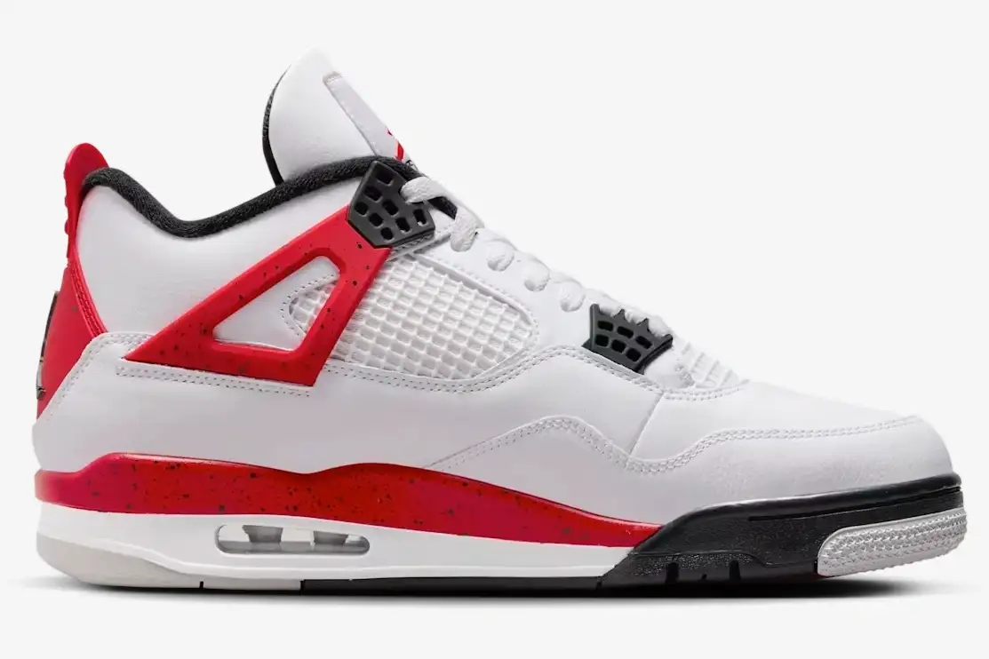 air-jordan-4-retro-red-cement-side-view-dh6927-161-235-410 Side profile of Air Jordan 4 Retro Red Cement sneakers featuring white leather and red speckled accents. - SKU DH6927-161