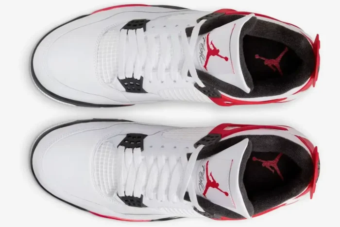 Top-down view of Air Jordan 4 Retro Red Cement sneakers in white, black, and red. - SKU DH6927-161