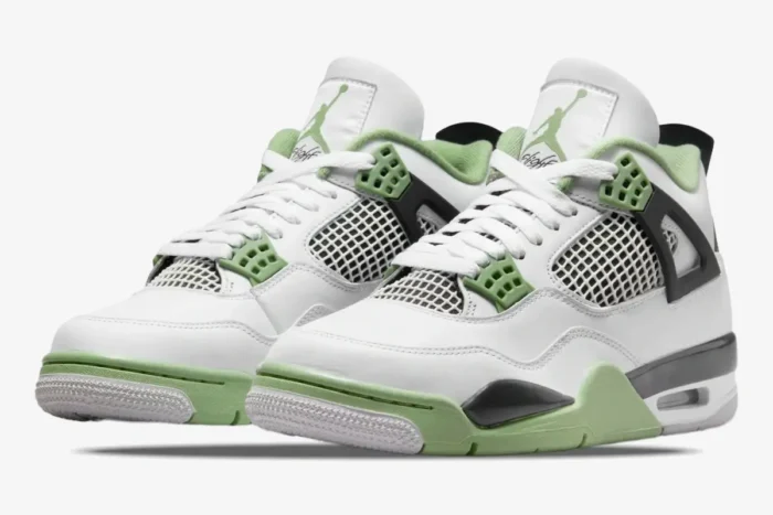 Air Jordan 4 Retro Seafoam Oil Green sneakers in a three-quarter front view, white leather with green accents. - SKU AQ9129-103
