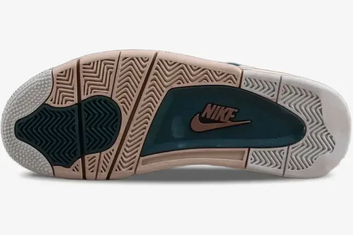 Outsole view of Air Jordan 4 Retro Snorlax Custom featuring tan and teal herringbone traction patterns.