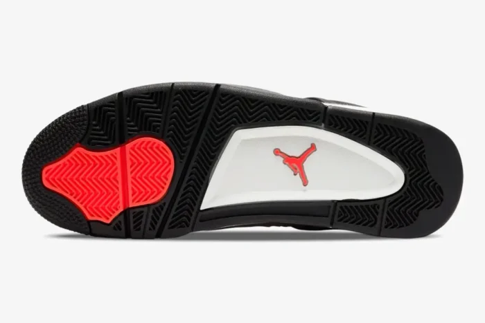 Bottom sole of Air Jordan 4 Retro Taupe Haze in black, white, and red with Jumpman logo. - SKU DB0732-200