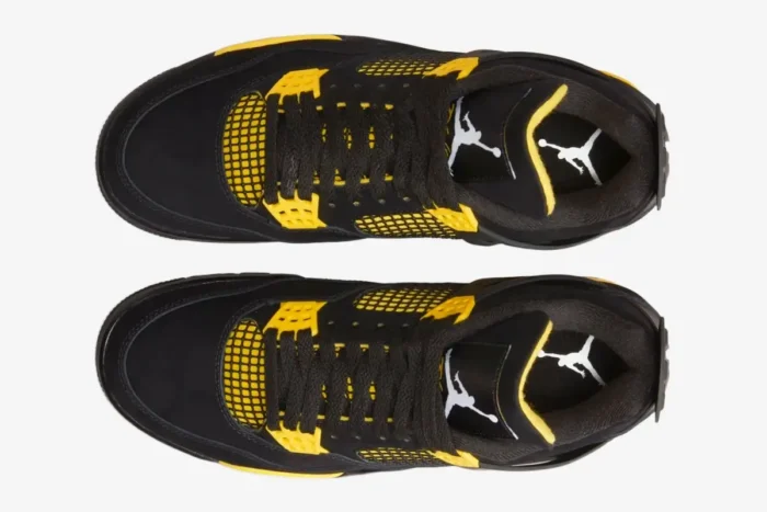 Top-down view of black and tour yellow Air Jordan 4 Retro Thunder sneakers with white Jumpman logos on the tongue. - SKU DH6927-017