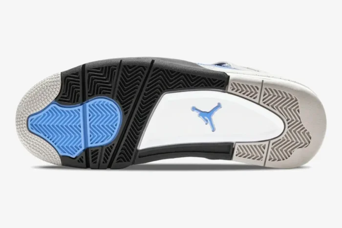 Bottom view of Air Jordan 4 Retro University Blue outsole with black, blue, and grey traction patterns. - SKU CT8527-400
