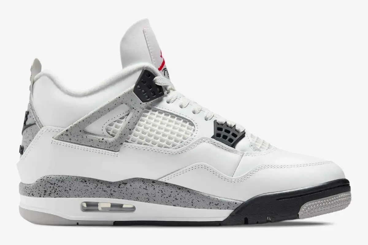 air-jordan-4-retro-white-cement-side-view-840606-192-565-859 Side profile of Air Jordan 4 Retro White Cement sneakers featuring white leather and grey speckled accents. - SKU 840606-192