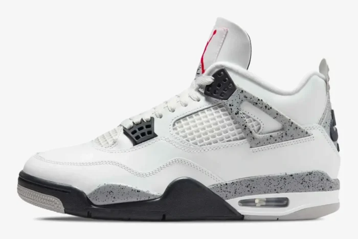 Side profile of the Air Jordan 4 Retro White Cement sneaker featuring white leather and grey speckled accents. - SKU 840606-192