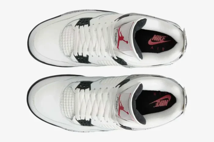Top-down view of Air Jordan 4 Retro White Cement sneakers with white leather and red Jumpman logo. - SKU 840606-192