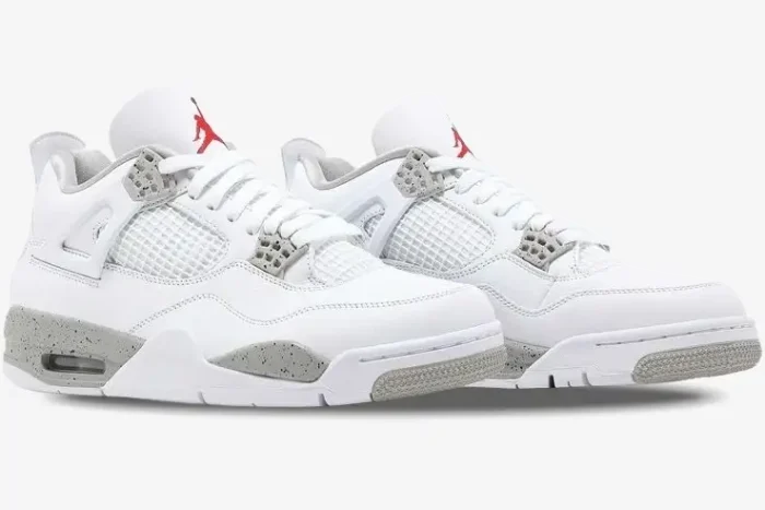 Air Jordan 4 Retro White Oreo sneakers in a side-profile view with white leather and grey speckled accents. - SKU CT8527-100