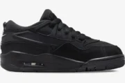 Side profile of the Air Jordan 4 RM Black Cat Remastered sneaker in all black. - SKU FQ7939-004