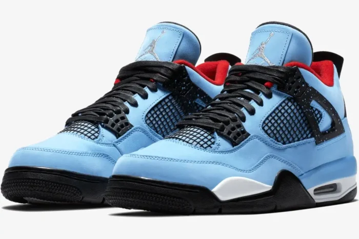 Air Jordan 4 Retro x Travis Scott Cactus Jack sneakers in university blue, front three-quarter view. - SKU 308497-406