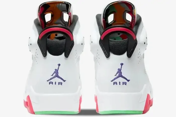 Rear view of white Air Jordan 6 Retro Hare sneakers featuring purple Jumpman logos and red accents. - SKU CT8529-062