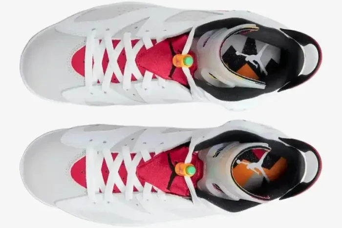 Top-down view of Air Jordan 6 Retro Hare sneakers featuring white leather, red accents, and multi-color tongues. - SKU CT8529-062