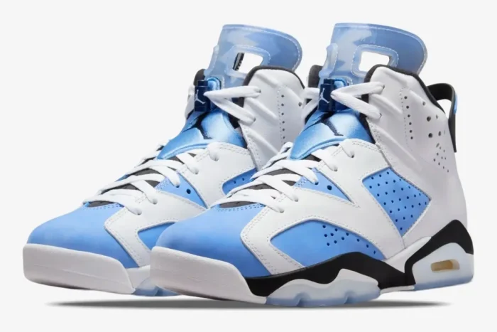 Air Jordan 6 Retro sneakers in white and university blue, shown from a three-quarter front angle. - SKU CT8529-410