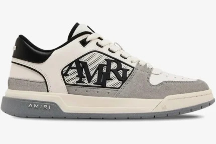 Amiri Classic Low sneaker in white, grey, and black, shown from a side profile view. - SKU AMFOSR1067-001
