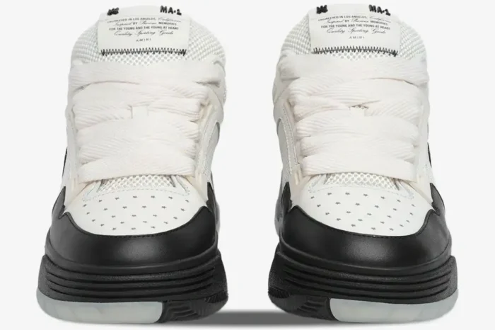 Front view of white and black Amiri MA-1 sneakers with chunky laces and star perforations on the toe. - SKU AMFOSR1001-101