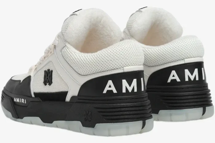 Rear view of white and black Amiri MA-1 sneakers featuring chunky soles and bold branding. - SKU AMFOSR1001-101