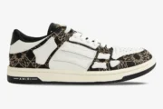 AMIRI MA Quad Skel Top Low black and white sneaker in a side profile view. - SKU AMFOSR1111-001