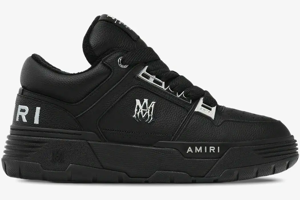 amiri-ma1-black-metallic-leather-sneakers-side-amfosr1152-001-185-176 Side profile of Amiri MA-1 leather sneakers in black metallic with silver logo details. - SKU AMFOSR1152-001