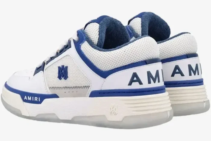 Amiri MA-1 sneakers in white and blue, rear side view showing heel branding and mesh panels. - SKU AMFOSR1048454