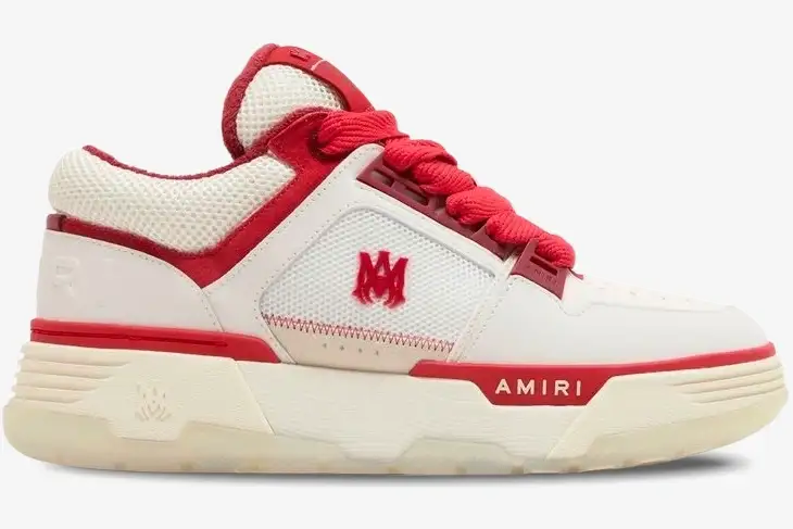 amiri-ma1-sneaker-white-red-side-view-ps24mfs018-610-437-932 Amiri MA-1 sneaker in white and red, side profile view showing chunky sole and red logo details. - SKU PS24MFS018-610