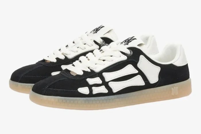 Amiri Pacific Bones sneakers in black and white with a gum sole, shown from a three-quarter side angle. - SKU amfosr1102-001