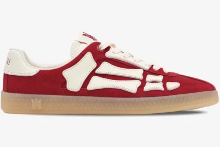 Amiri Pacific Skeleton Bone red suede sneakers with white bone overlays, side profile view. - SKU AMFOSR1135-644