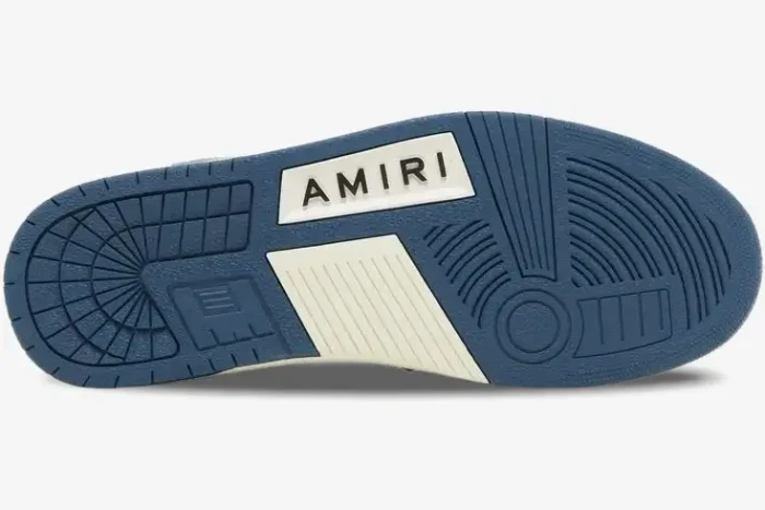 Bottom sole of an Amiri Skel Top Low sneaker in blue and white with the brand name. - SKU pf23mfs007-533