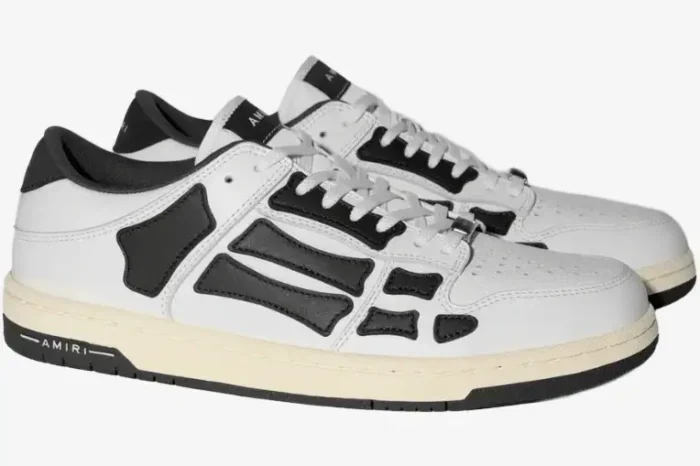 Amiri Skel Top Low sneakers in white and black leather, side three-quarter view. - SKU PS22MFS003-111