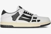 Amiri Skel Top Low sneaker in white and black leather, side profile view. - SKU PS22MFS003-111