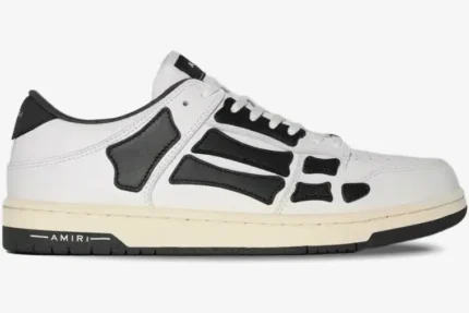 Amiri Skel Top Low sneaker in white and black leather, side profile view. - SKU PS22MFS003-111