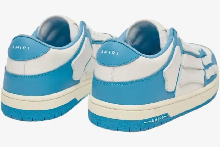 Rear view of Amiri Skel Top Low sneakers in white and blue with skeleton-inspired leather overlays. - SKU MFS003-462