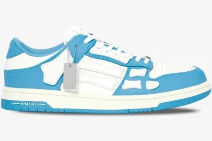 Amiri Skel Top Low sneaker in white and blue with skeleton bone appliqués, side profile view. - SKU MFS003-462