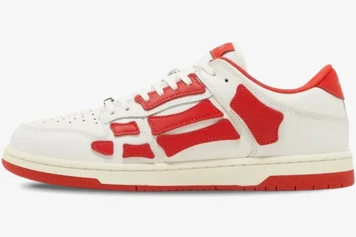 Side profile of Amiri Skel Top Low white and red leather sneakers with skeleton bone appliqués. - SKU mfs003-124