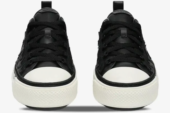 Front view of black Amiri Stars Court leather sneakers with white toe caps and thick white soles. - SKU AMFOSR1178-083