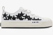 Side view of white Amiri Stars Court Low-Top Sneakers with black star patches and platform sole. - SKU AMFOSR1179-111