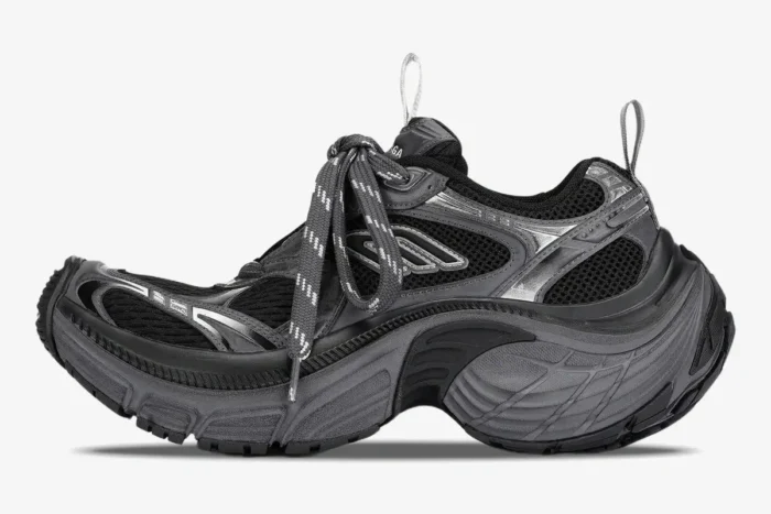 Side profile of a Balenciaga 10XL Sneaker in grey, black, and silver with an oversized, curved sole. - SKU 815859W2MV21012