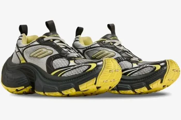 Side view of Balenciaga 10XL sneakers in grey, yellow, and black with a chunky, distressed design. - SKU 792779w2mv21097