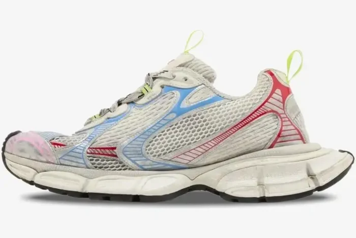 Side profile of Balenciaga 3XL Sneaker Distressed Multi-Color Edition with mesh upper and colorful overlays. - SKU 734734W3XL59645