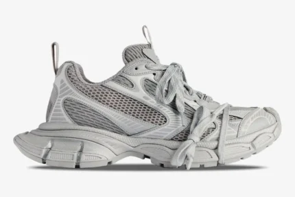 Balenciaga 3XL grey low top sneakers in a side profile view, featuring mesh panels and a chunky sole. - SKU 734734W3XLR1281