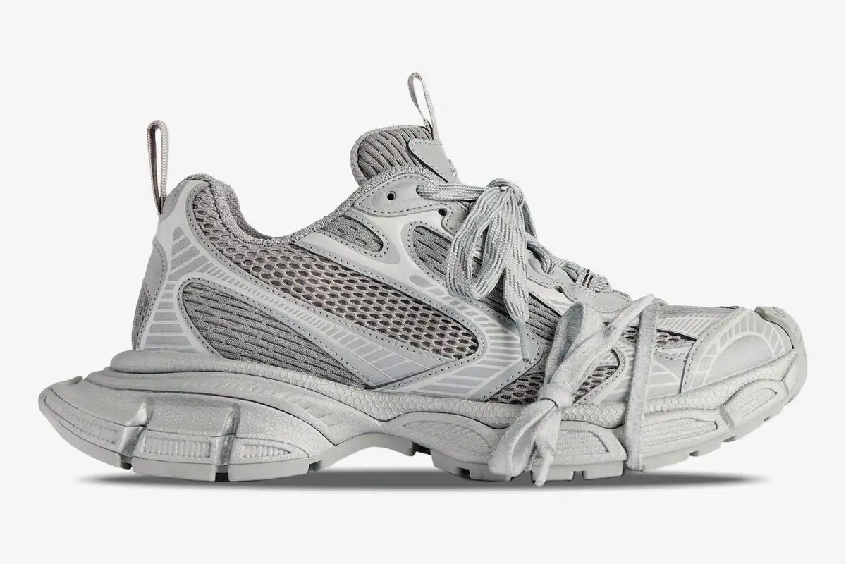 balenciaga-3xl-grey-mesh-sneakers-side-view-734734w3xlr1281-271-380 Balenciaga 3XL grey low top sneakers in a side profile view, featuring mesh panels and a chunky sole. - SKU 734734W3XLR1281