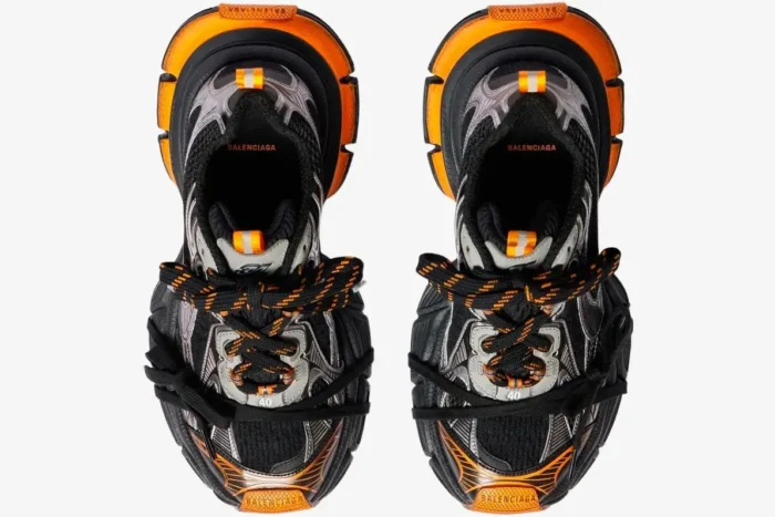 Top-down view of Balenciaga 3XL mesh sneakers in orange, grey, and black with chunky soles. - SKU 734734W3XL31178