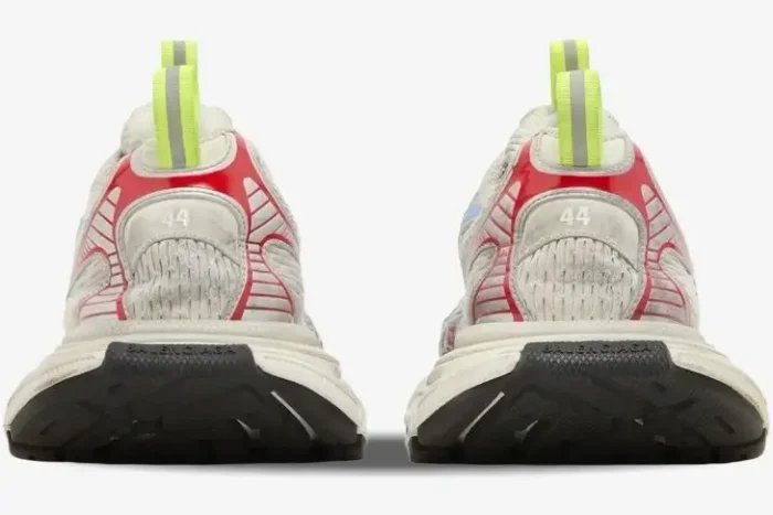 Rear view of Balenciaga 3XL Distressed Multi-Color sneakers with red accents and neon yellow pull tabs. - SKU 734734W3XL59645
