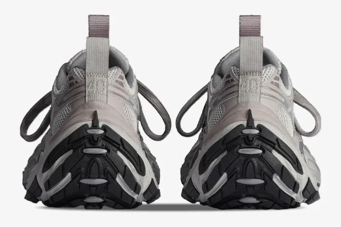 Rear view of grey Balenciaga 6XL Oversized sneakers with chunky black treaded soles and pull tabs. - SKU 815853W2MV22211