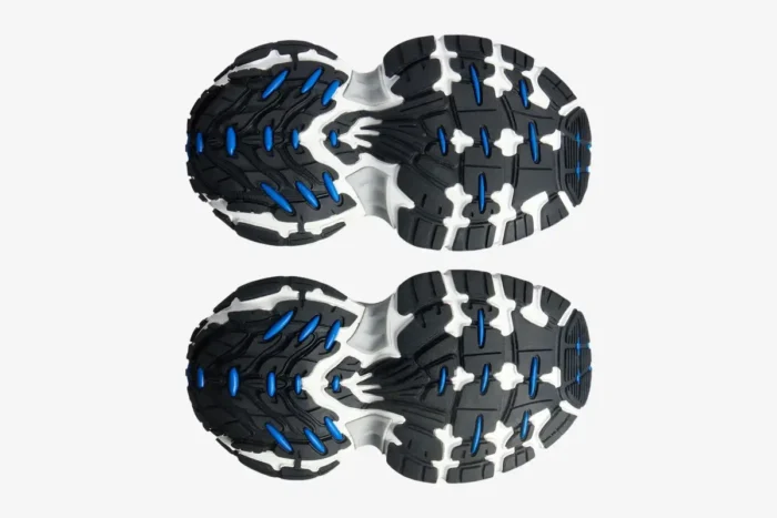 Bottom view of Balenciaga 6XL Sneaker outsoles in grey, blue, and white with a chunky tread design. - SKU 815859W2MV21490