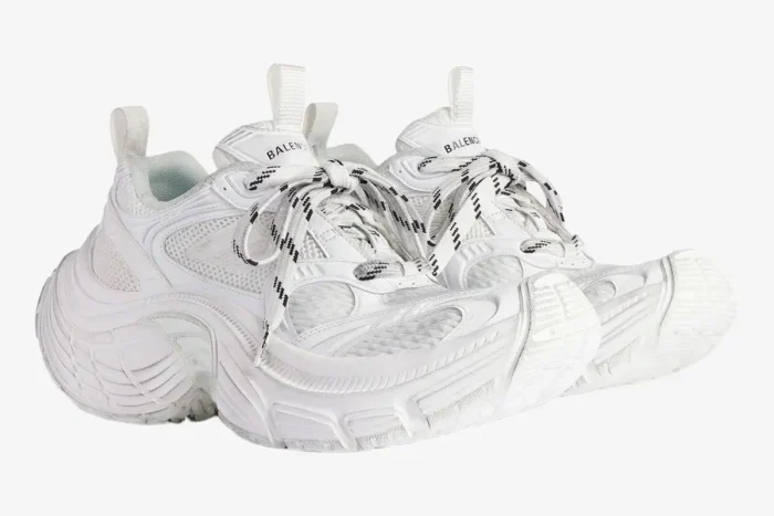 Balenciaga 6XL white oversized sneakers in a three-quarter side view with chunky soles and patterned laces. - SKU 815853W2MV29000